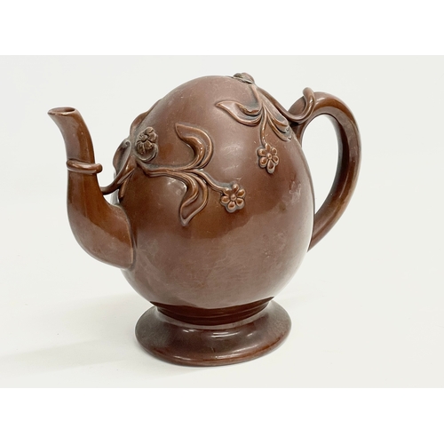 46 - A late 19th century Copeland Treacle Glazed Cadogan pottery teapot. 24x13x19.5cm