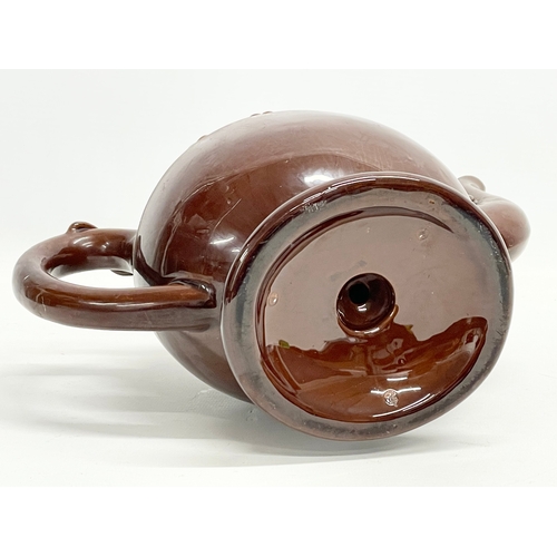 46 - A late 19th century Copeland Treacle Glazed Cadogan pottery teapot. 24x13x19.5cm