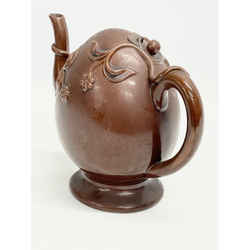 46 - A late 19th century Copeland Treacle Glazed Cadogan pottery teapot. 24x13x19.5cm