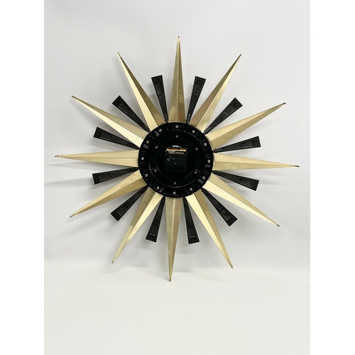 55 - A Mid Century ‘Sunburst’ wall clock. Metamec. 60cm