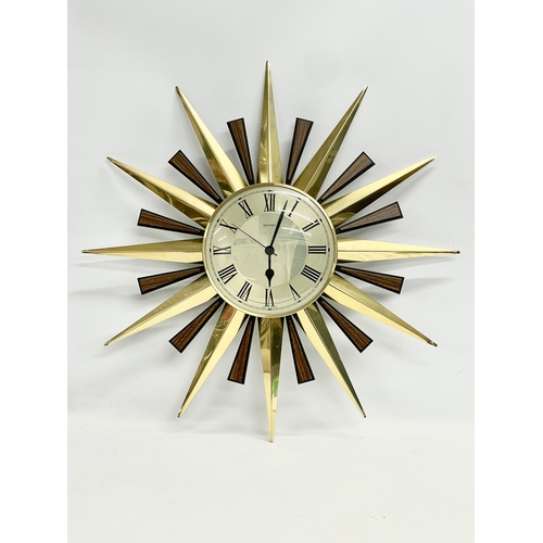 55 - A Mid Century ‘Sunburst’ wall clock. Metamec. 60cm