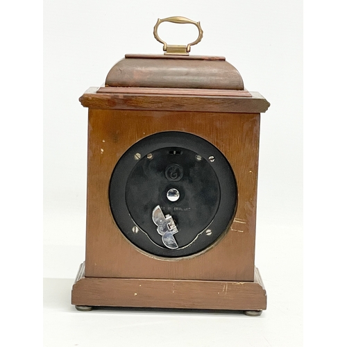 56 - An Elliot London brass face mantle clock by Garrard & Co. 15.5x8.5x23cm