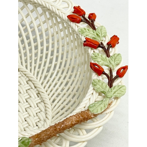 66 - A Belleek Pottery ‘Fuchia Basket’ with box. 20x16x7cm