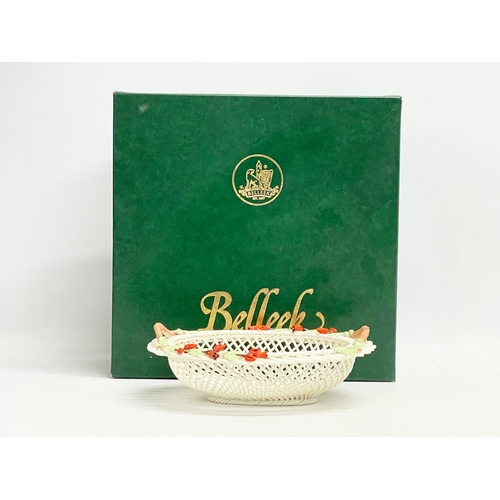 66 - A Belleek Pottery ‘Fuchia Basket’ with box. 20x16x7cm