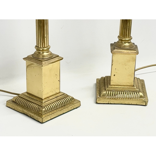 135 - A pair of large brass table lamps with Corinthian style columns. 16.5x16.5x65.5cm