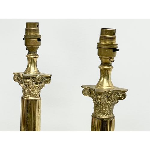 135 - A pair of large brass table lamps with Corinthian style columns. 16.5x16.5x65.5cm