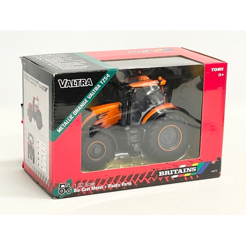 349 - An unused Britains Valtra Metallic Orange Valtra TZ54 Tractor in box. 1:32 scale. Die Cast Model and... 