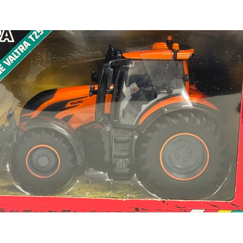 349 - An unused Britains Valtra Metallic Orange Valtra TZ54 Tractor in box. 1:32 scale. Die Cast Model and... 