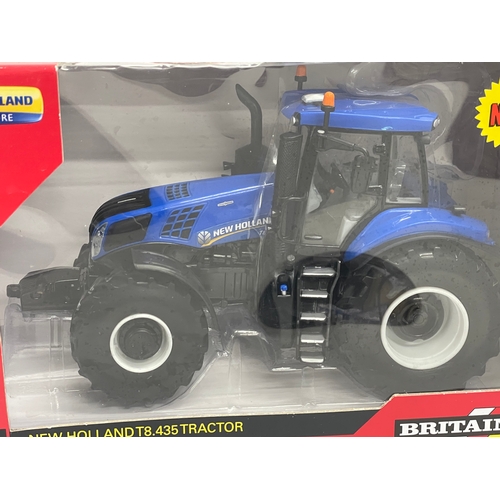 351 - An unused Britains “New Holland” T8.435 Tractor in box. 1:32 scale. 25x13x15.5cm