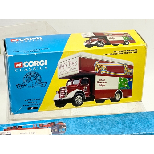 390 - 4 boxes of Corgi models.