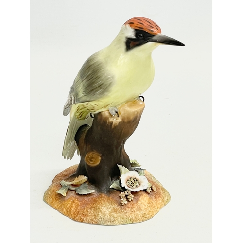 258 - A Royal Crown Derby “Green Woodpecker” figurine. 15cm