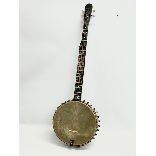 366 - A vintage banjo with case. Banjo measures 89cm