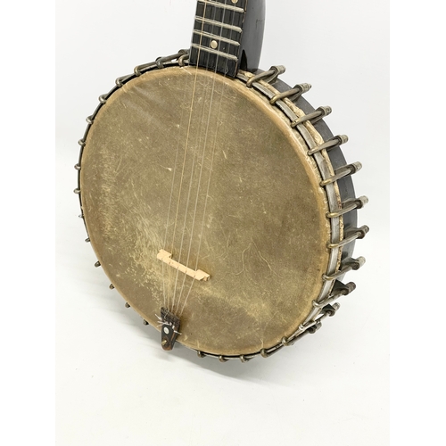 366 - A vintage banjo with case. Banjo measures 89cm