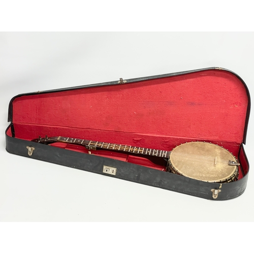 366 - A vintage banjo with case. Banjo measures 89cm