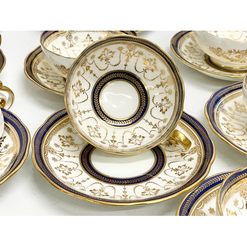 85 - A fine 40 piece Cauldon LTD gilt and cobalt blue tea service. Early 20th century. 1905-1920.