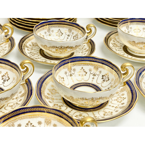 85 - A fine 40 piece Cauldon LTD gilt and cobalt blue tea service. Early 20th century. 1905-1920.