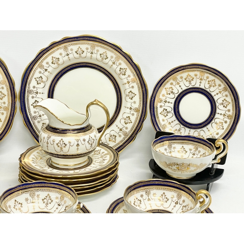 85 - A fine 40 piece Cauldon LTD gilt and cobalt blue tea service. Early 20th century. 1905-1920.