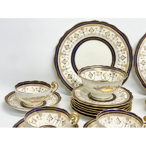 85 - A fine 40 piece Cauldon LTD gilt and cobalt blue tea service. Early 20th century. 1905-1920.