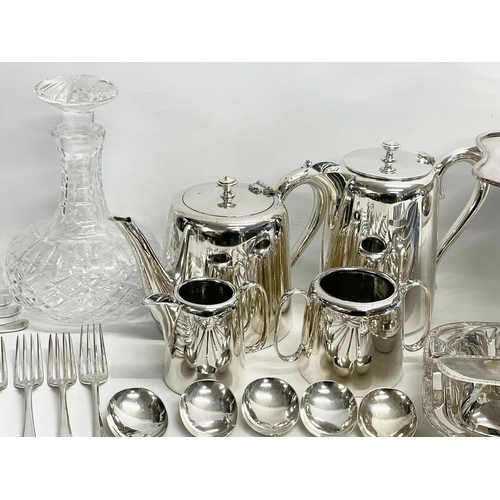 245 - A collection of good quality plated cutlery. 4 piece plated hotel ware set. Crystal decanter (stoppe... 