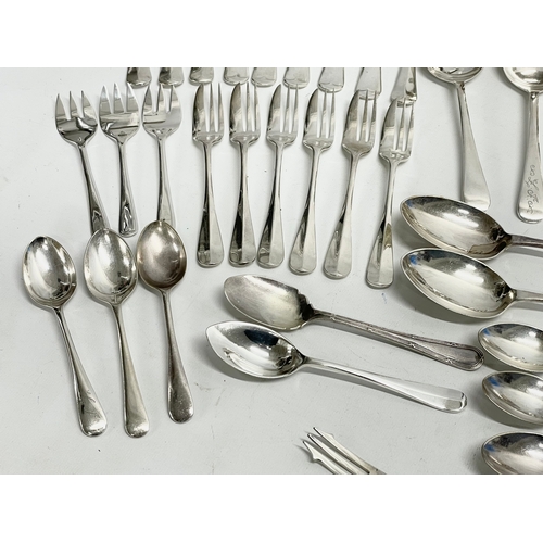 245 - A collection of good quality plated cutlery. 4 piece plated hotel ware set. Crystal decanter (stoppe... 