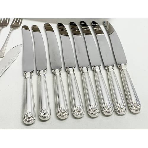 245 - A collection of good quality plated cutlery. 4 piece plated hotel ware set. Crystal decanter (stoppe... 