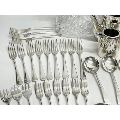 245 - A collection of good quality plated cutlery. 4 piece plated hotel ware set. Crystal decanter (stoppe... 