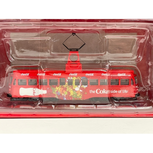 524 - 2 Corgi Coca Cola models in boxes. Coca-Cola Double Decker Tram, 1:76 die cast model. Coca-Cola Sing... 