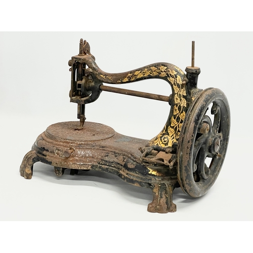 268 - A late 19th century sewing machine. 34cm