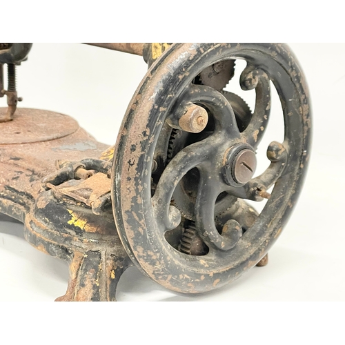 268 - A late 19th century sewing machine. 34cm