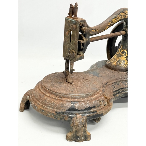 268 - A late 19th century sewing machine. 34cm