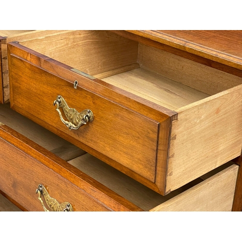 1013 - A late Victorian walnut dressing chest. Circa 1900. 122x51x156cm (9)