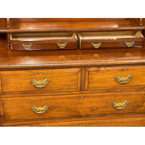 1013 - A late Victorian walnut dressing chest. Circa 1900. 122x51x156cm (9)