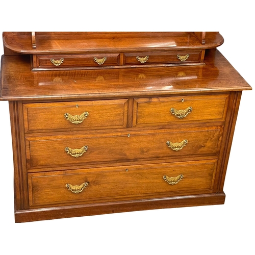 1013 - A late Victorian walnut dressing chest. Circa 1900. 122x51x156cm (9)