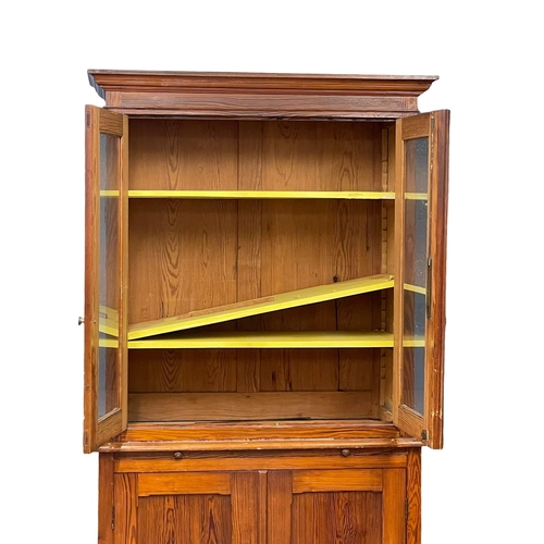 1023 - A large Victorian pitch pine kitchen dresser with brushing slide and glazed doors. 109x47x228cm (4)