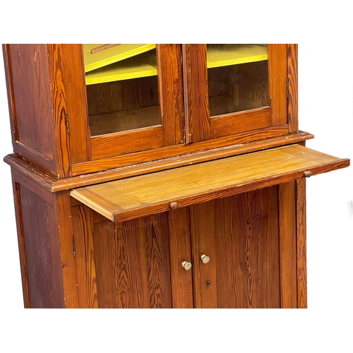 1023 - A large Victorian pitch pine kitchen dresser with brushing slide and glazed doors. 109x47x228cm (4)