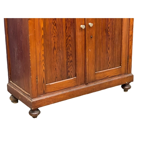 1023 - A large Victorian pitch pine kitchen dresser with brushing slide and glazed doors. 109x47x228cm (4)