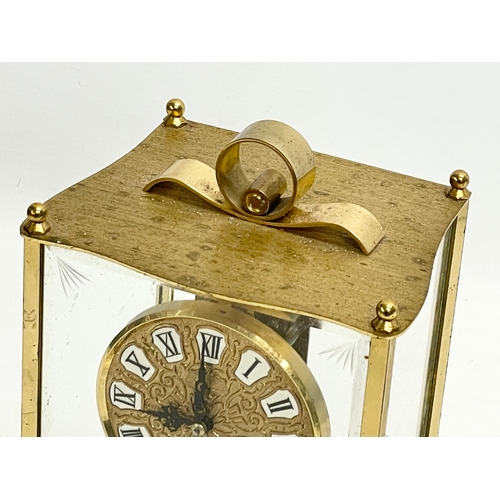 237 - A brass mantle clock with etched bevelled glass panels. Kundo, Kieninger & Obergfell. West Germany. ... 