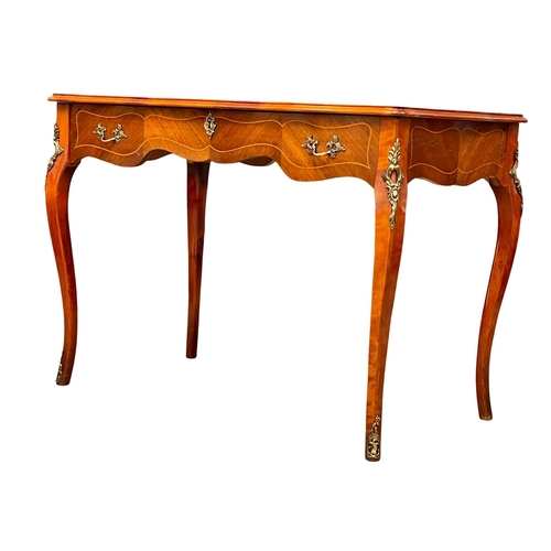 1043 - A French 18th century style inlaid Kingwood and mahogany writing desk with brass ormolu mounts. 103x... 