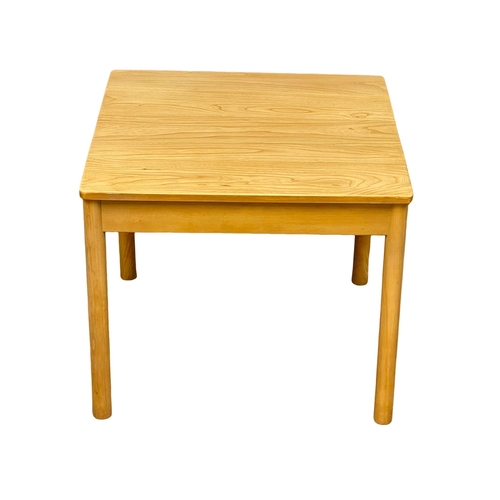 1034 - An Ercol blonde elm lamp table. 63.5x65x54cm (9)