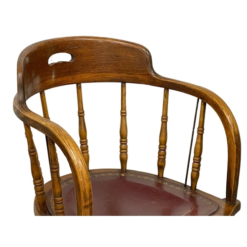 1053 - An early 20th century oak swivel desk chair by Heywood Brothers & Wakefield Co. Circa 1900. (9)