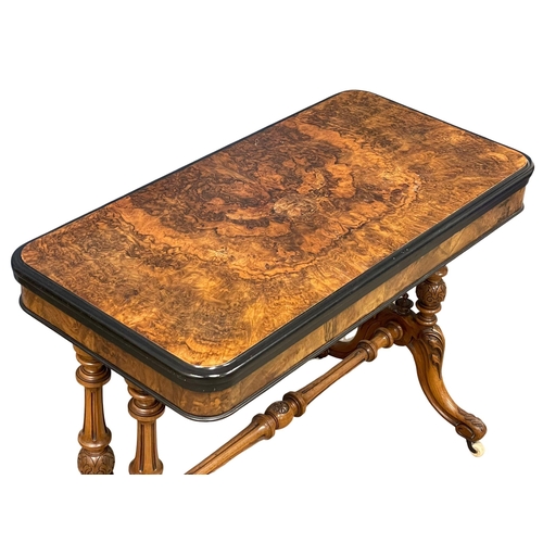 1037 - A good quality Victorian Burr Walnut turnover games table with stretcher support on Cabriole legs. C... 