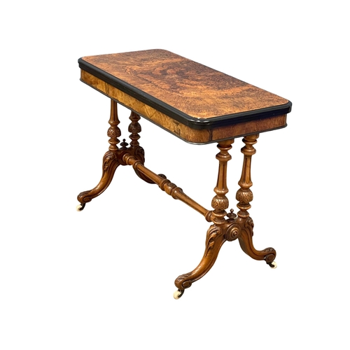 1037 - A good quality Victorian Burr Walnut turnover games table with stretcher support on Cabriole legs. C... 