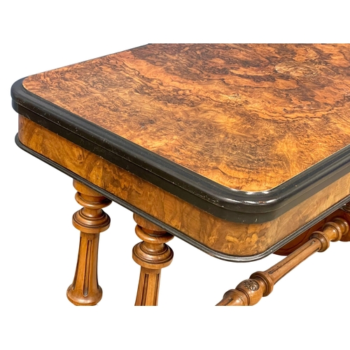 1037 - A good quality Victorian Burr Walnut turnover games table with stretcher support on Cabriole legs. C... 