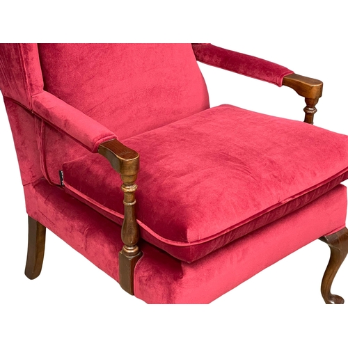 1058 - A wingback armchair on cabriole legs. (8)