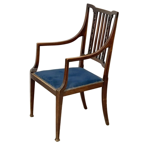 1057 - An Edwardian mahogany armchair. (8)