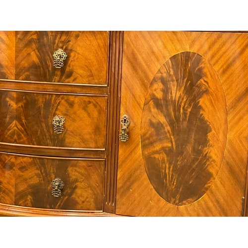 1056 - An early 20th century Chippendale Revival mahogany sideboard on Ball & Claw feet. 152x51x127cm (8)