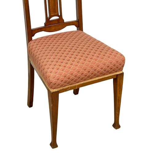 1054 - A pair of Edwardian inlaid mahogany high back side chairs. (8)