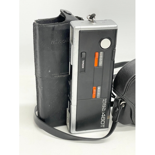 377 - A vintage Praktica B-100 Electronic camera with case and. Minolta Autopak 460T with case.