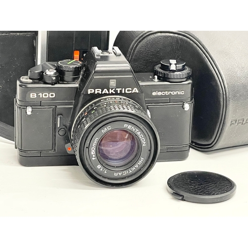 377 - A vintage Praktica B-100 Electronic camera with case and. Minolta Autopak 460T with case.