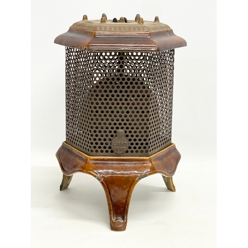 271 - An early 20th century enamelled gas heater. 21x31x31cm